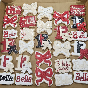 Bella's 12th birthday: custom sugar cookies with bows and Happy Birthday text