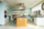 Bright white kitchen paint color achieving a clean and timeless look with stainless steel appliances