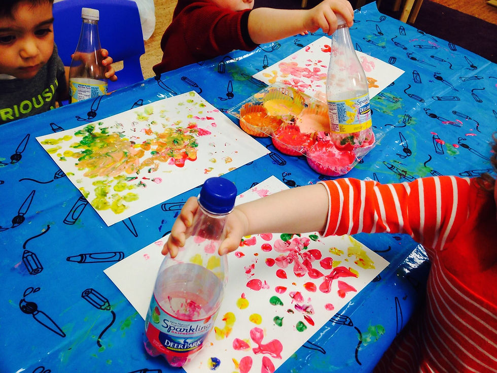 Recycling bottles! Fun with art and gross motor skills