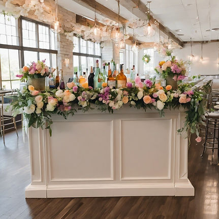 bar with spring florals for a wedding reception.jpg