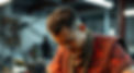 asian worker in tribal gear assembling electronics_edited.jpg