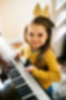 little-girl-playing-a-piano-2022-12-16-01-00-52-utc.jpg