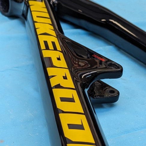 nukeproof mega carbon bike frame with down tube repair