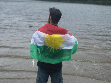 Man covered in a flag