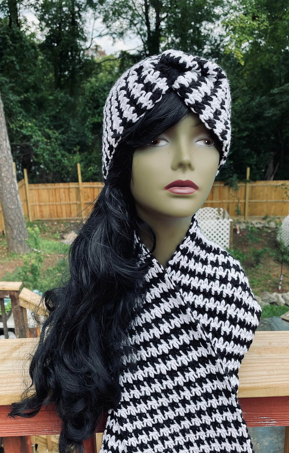 This crochet headband and scarf is black and white with a houndstooth design.