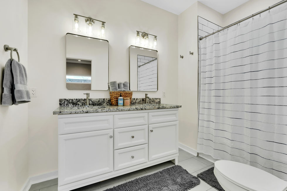 Modern bathroom with double vanity in Indianapolis home