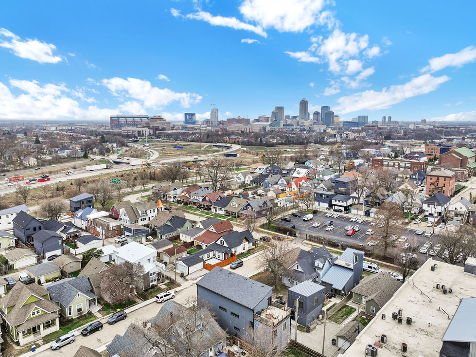 Aerial drone photo of modern home in Fountain Square Indianapolis with downtown skyline in background