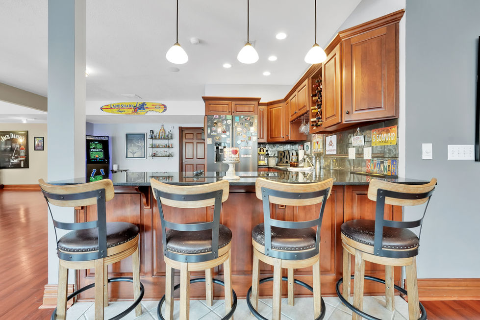 Spacious kitchen design with cabinetry and island in Indiana home