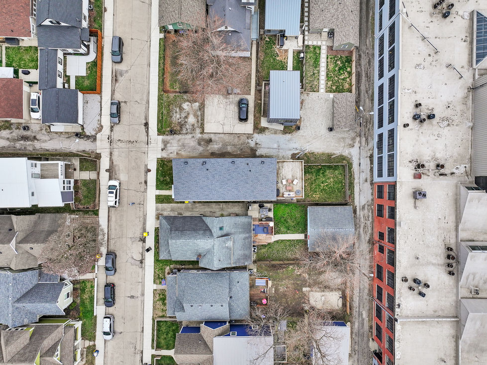 High-angle aerial photo of modern Indianapolis home with surrounding neighborhood view