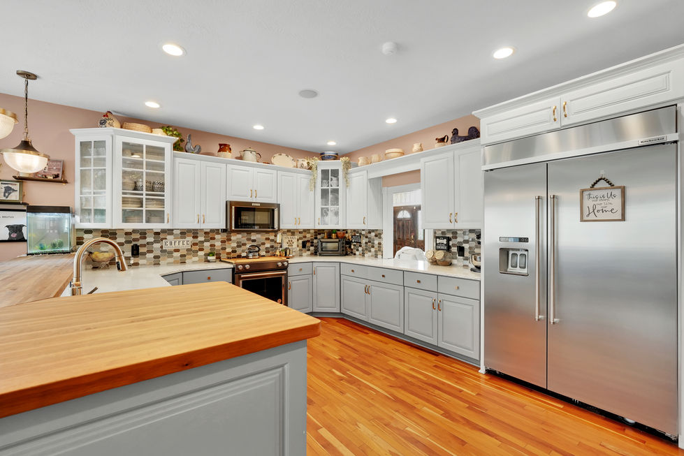 Real estate photo of high-end kitchen with stainless steel appliances
