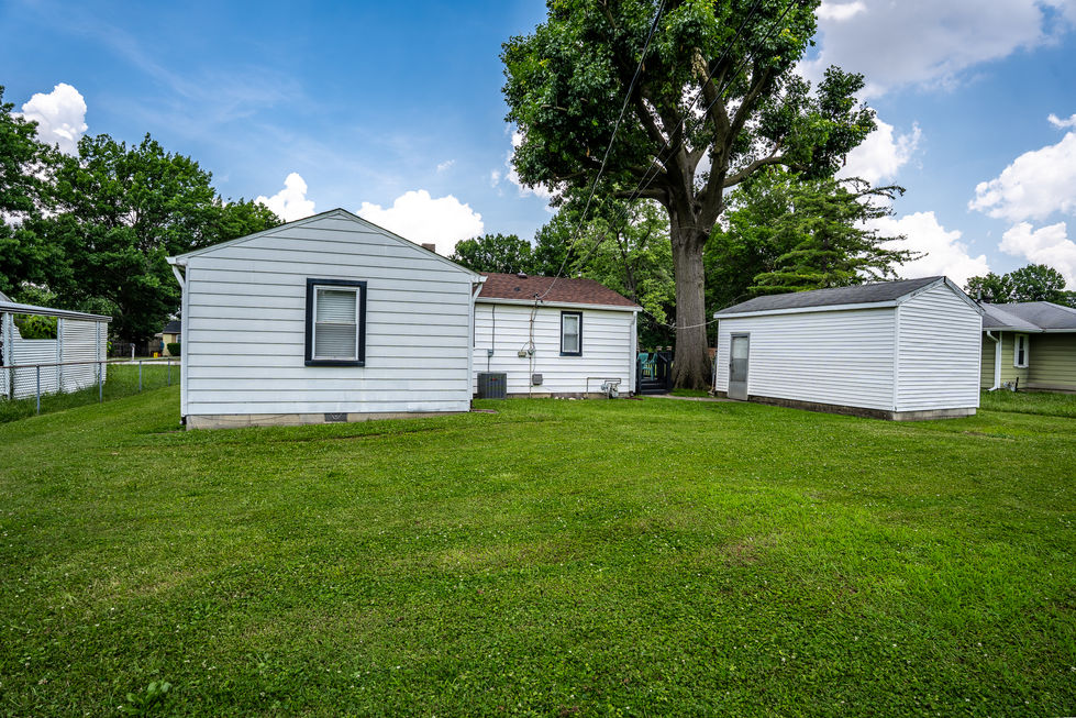 Backyard entryway and rear exterior of 4639 Terrace Ave home.