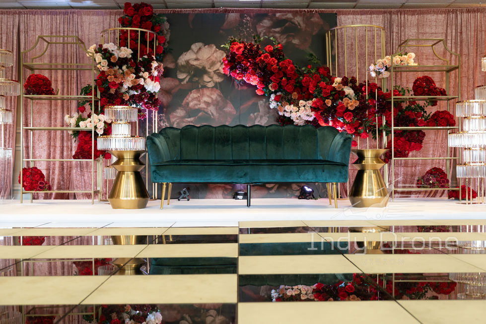Romantic lighting and draped fabric decor over a reception area entrance