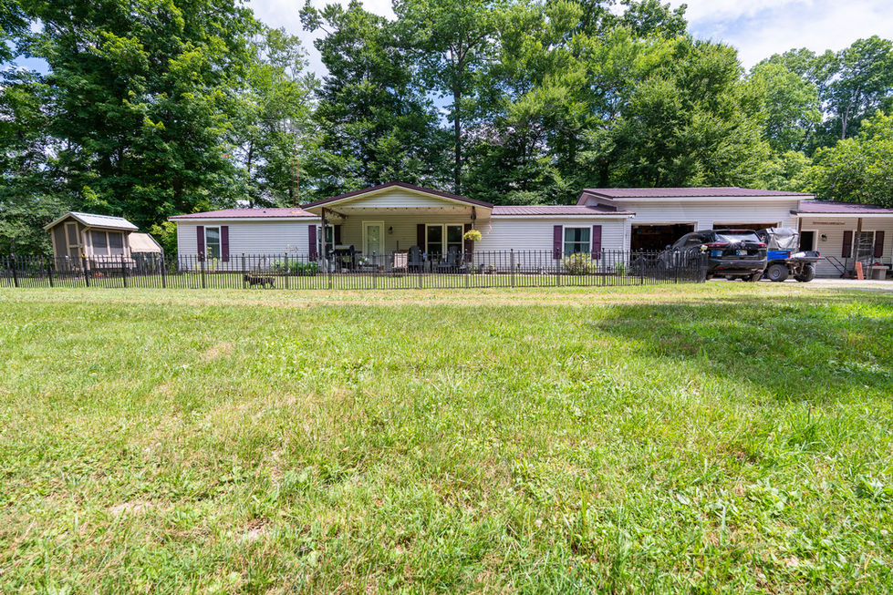Country home exterior with front porch in Spencer Indiana.