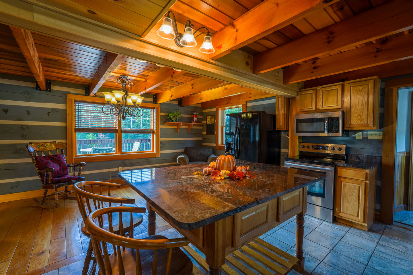 Wide-angle kitchen photo showcasing custom cabinetry and island in Nashville Indiana property.