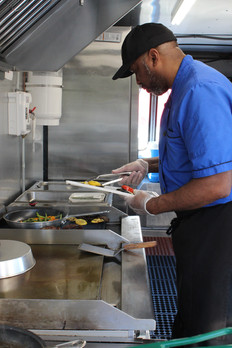 Chef Mark cooks vegetables in truck. Wilmington, DE. 