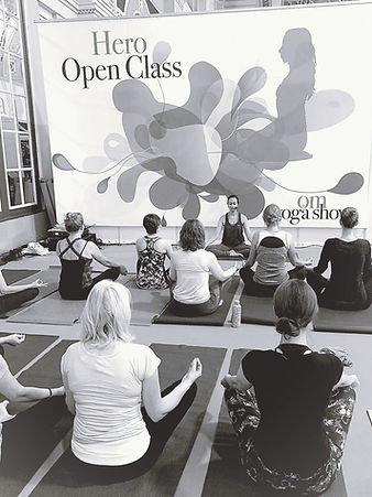 Chanda Patel leading a live group wellness and breathwork session at a corporate event spa