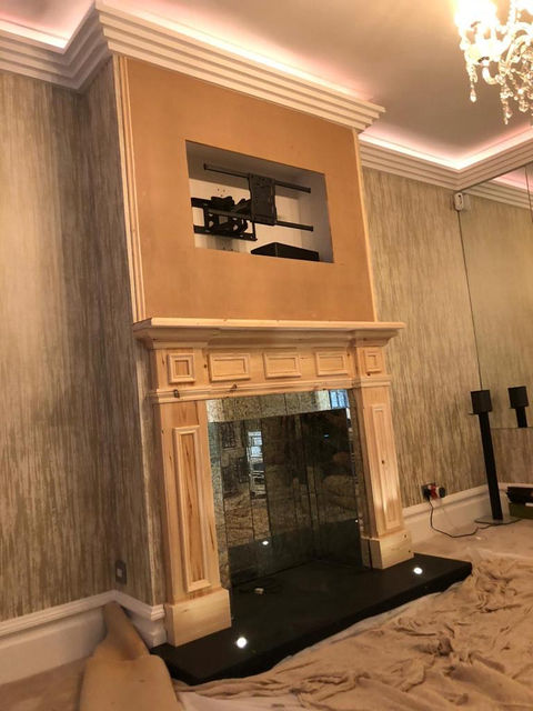 Bespoke Fire place with distressed glass tiles and Black Granite Hearth