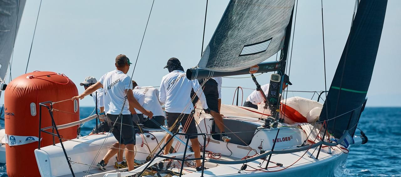 Melges 32 'Adrenalin' for sale, racing round the leeward mark with crew dropping the spinnaker