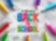 Colorful pencils form a circle around "Welcome Back to School" text with doodles in the background, creating a cheerful, vibrant atmosphere.