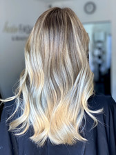 woman with a warm blonde balayage 