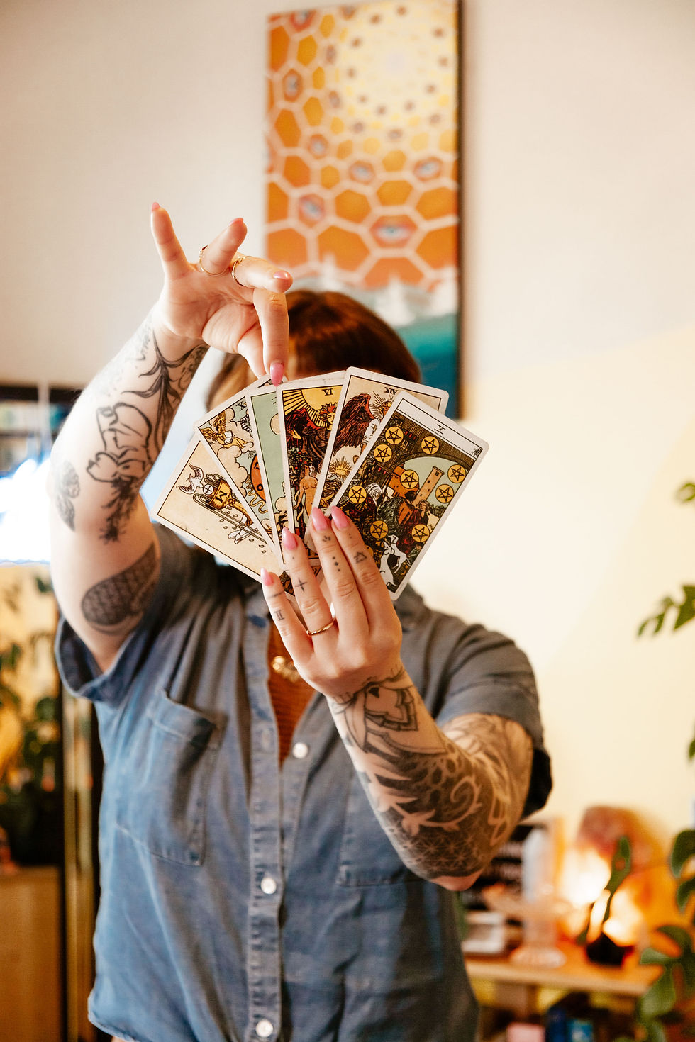 Lucy Stainsby Pulling A Tarot Card from a spread