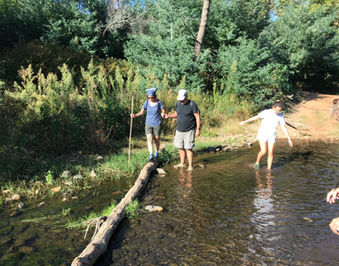 Crossing the river during the Hot Spring Hike