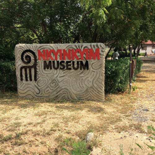 Entrance sign at Nkyimkyim Museum in Ada, Ghana