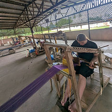 Man weaving Kente