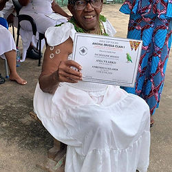woman sitting and holding certificate