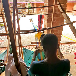 Man weaving Kente