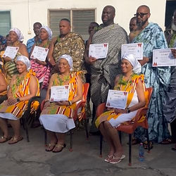 peoplw dressed in ghana traditional clothes holding certificates