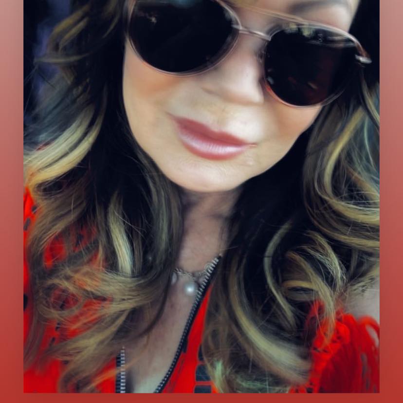 Brenda McNeely headshot, wearing darn sunglasses