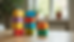 Close-up view of colorful building blocks stacked on a table