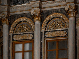 Gold leaf gilding on classical interior architecture featuring ornate decorative columns, luxury moldings, and handcrafted finishes by MIDAS TOUCH by Shehzad Khan, Mumbai.