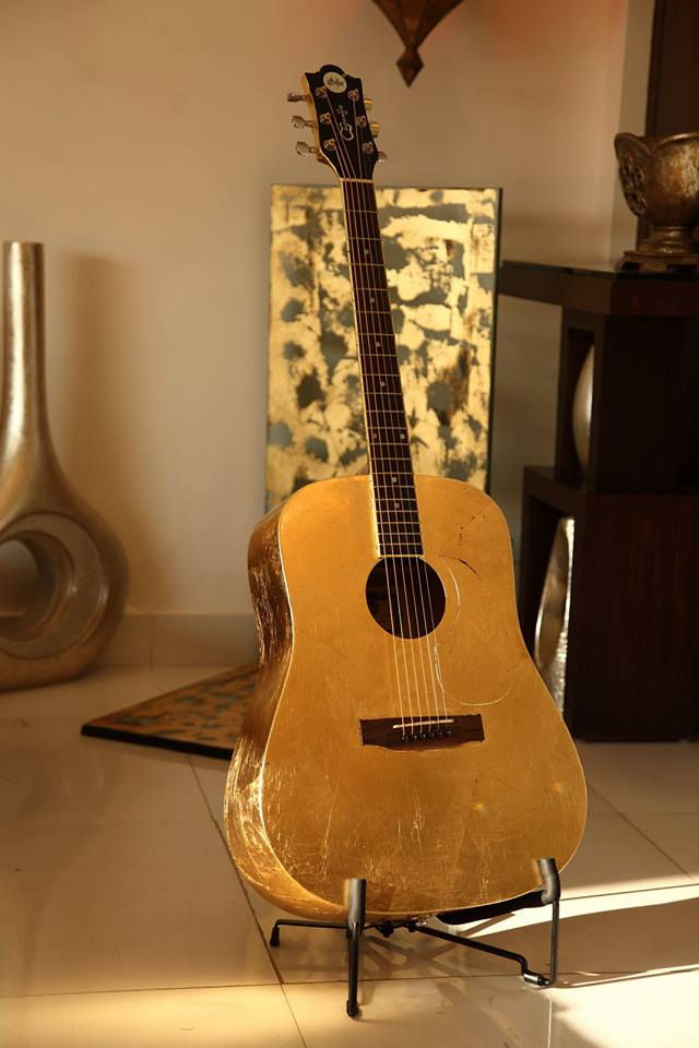 Luxury guitar with real 24K gold leaf gilding by MIDAS TOUCH by Shehzad Khan, showcasing intricate handcrafted detailing on a musical instrument in Mumbai, India.