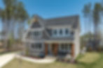 Contemporary two-story home featuring a welcoming covered front porch, professionally landscaped yard, mature wooded surroundings, and exceptional curb appeal.