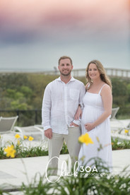 Their hand-in-hand pose embodies unity and love in this heartfelt 30A Maternity Portraits capture.