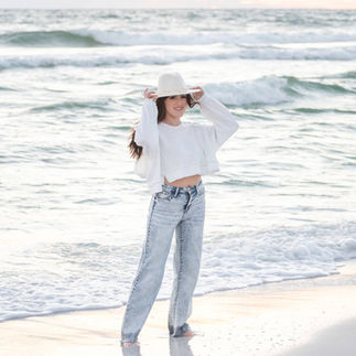Professional solo beach portrait session in Panama City Beach featuring soft sunset colors and coastal beauty.