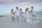 Stunning family portrait by a Santa Rosa Beach Photographer on the white sands