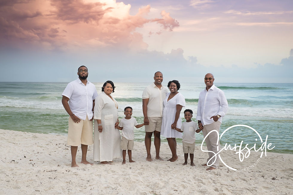 Family walking at golden hour along sugar-white sand, asking where can I book a beach portrait session in Santa Rosa Beach for our trip.