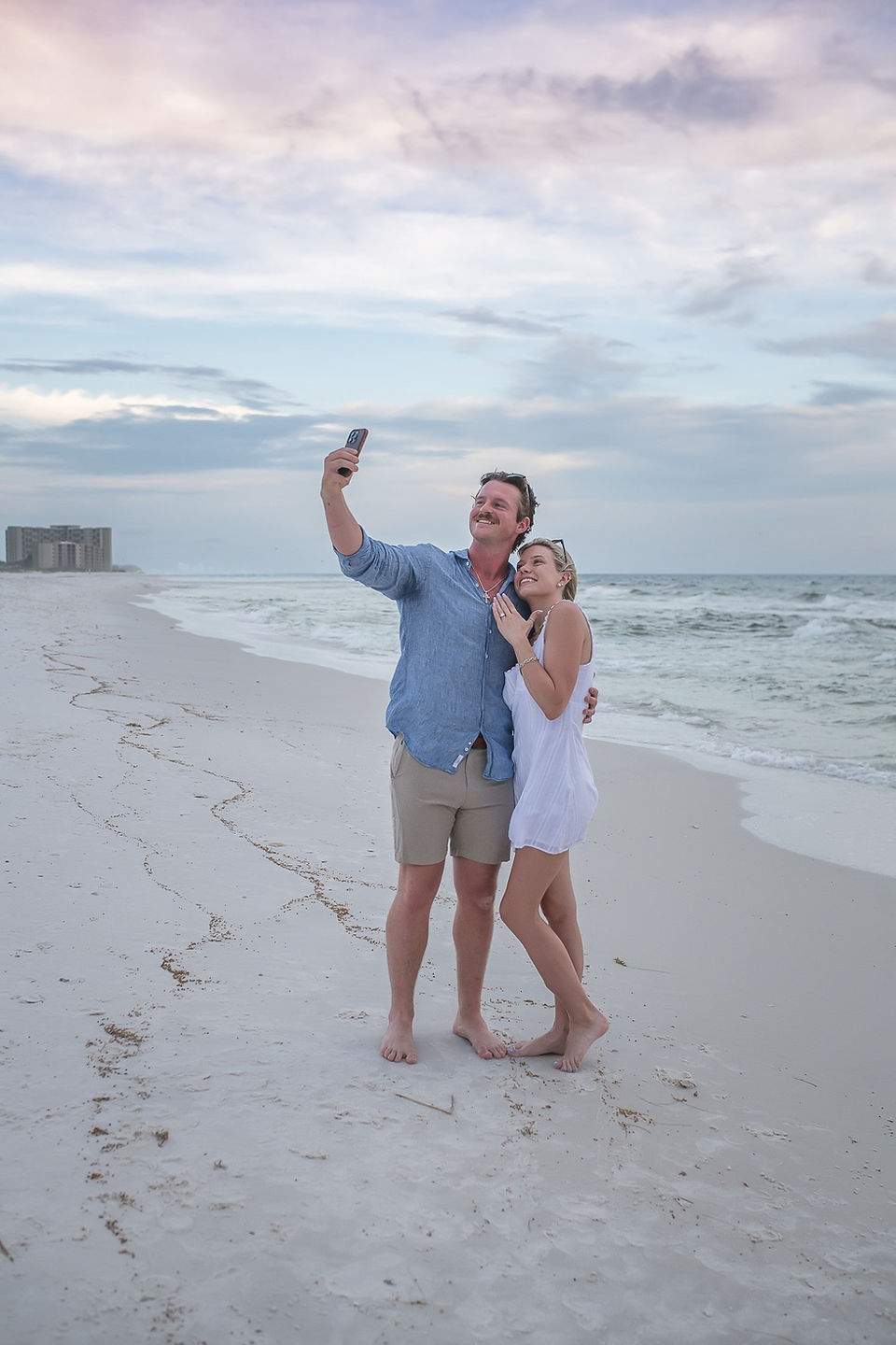 Footprints in the sugar-white sand lead to the spot where a perfect surprise proposal in 30A took place at dusk.