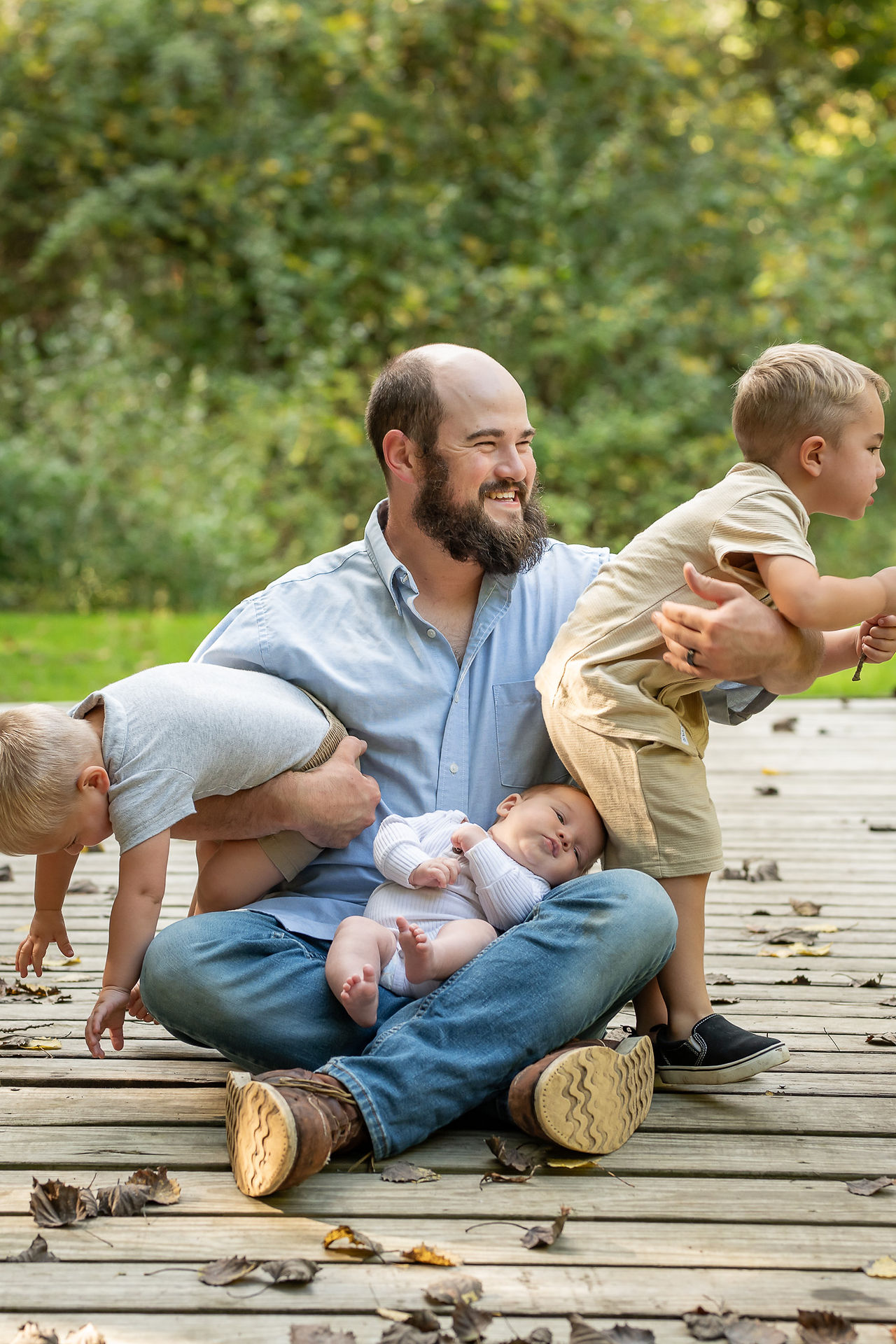 For three little boys and their parents, families often ask who is the best family portraits photographer to catch spontaneous moments in Caro, Michigan.