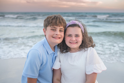 Mother and father enjoying a beach vacation while discovering where to buy heirloom art photography prints in 30A Florida.