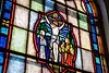 Stained glass window depicting the crucifixion of Jesus.