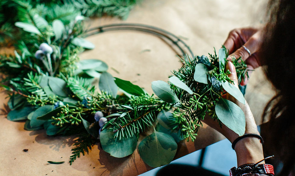 Woman creating christmas wreath