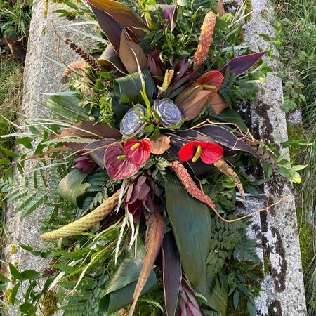 Natural countryside inspired casket spray for a funeral in Hampshire.