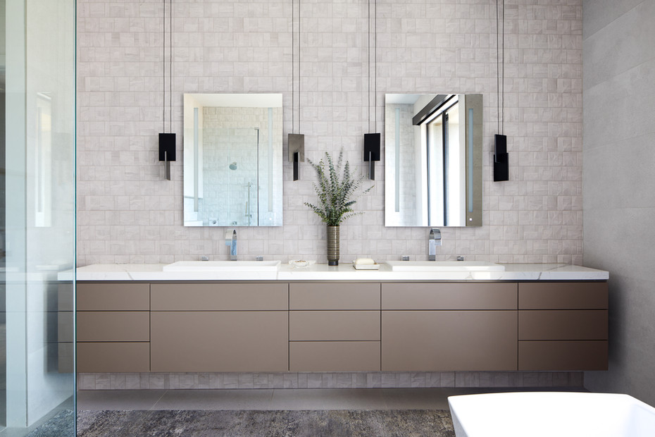 Upscale Sedona bathroom with floating double vanity matte tile backsplash and modern pendant lighting