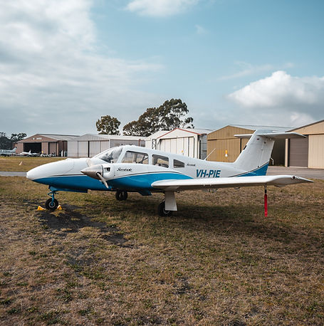 SFT Fleet - VH-PIE Piper Seminole parked on grass