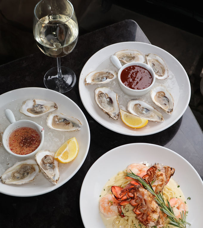 East Coast oysters on the half shell and grilled shrimp dish at Palazzo Cleveland fine Italian restaurant in Ohio City