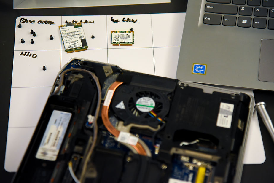 Disassembled laptop with hardware for Data+ Certification